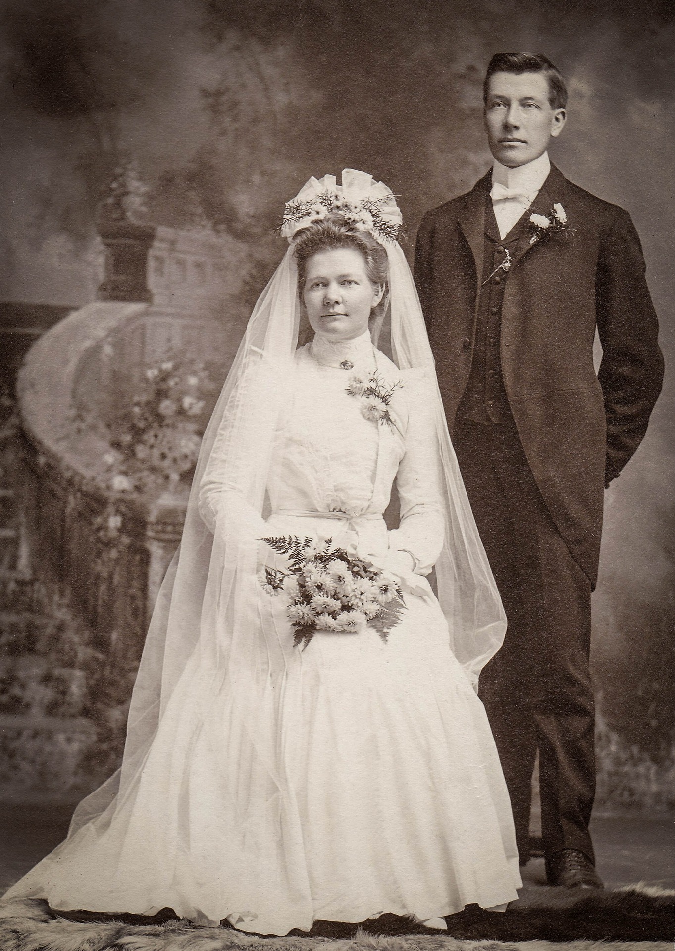 A vintage photograph of a bride and groom.